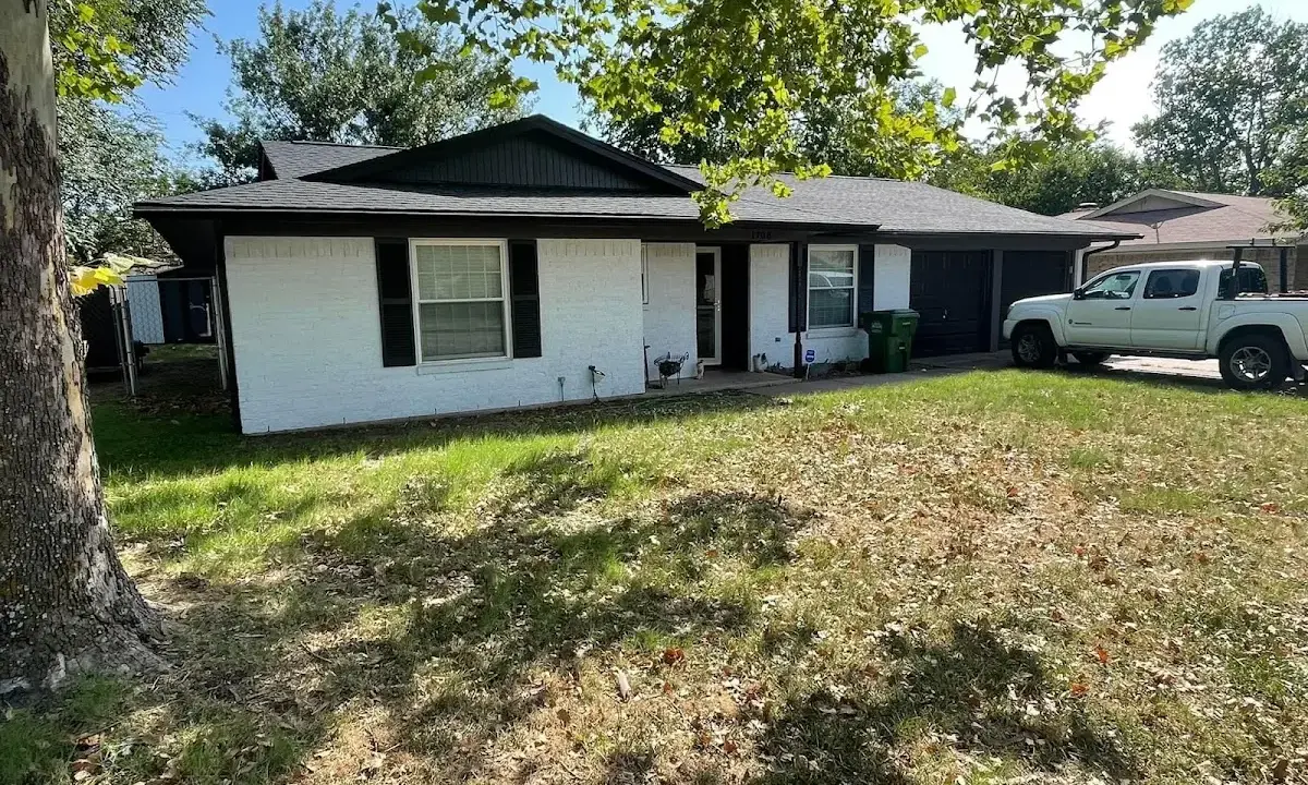 Professional roofing crew working on a residential roof in Cortez